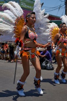 Arica, Chile - January 23, 2016: Tobas dancers in traditional Andean costume performing at the annual Carnaval Andino con la Fuerza del Sol in Arica, Chile.