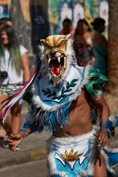 Arica, Chile - January 23, 2016: Tobas dancers in traditional Andean costume performing at the annual Carnaval Andino con la Fuerza del Sol in Arica, Chile.