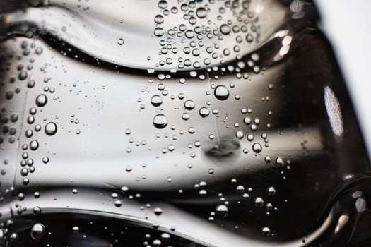 Bubbles in water on a gray background close up