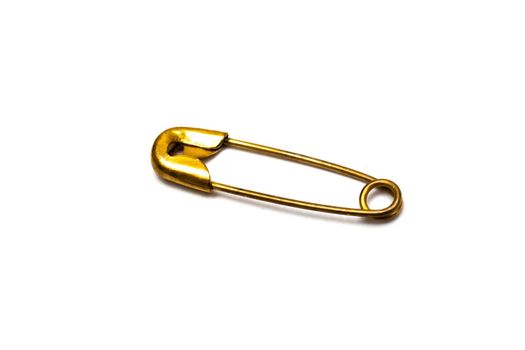 Yellow pin close up, isolated on white background, macro photo