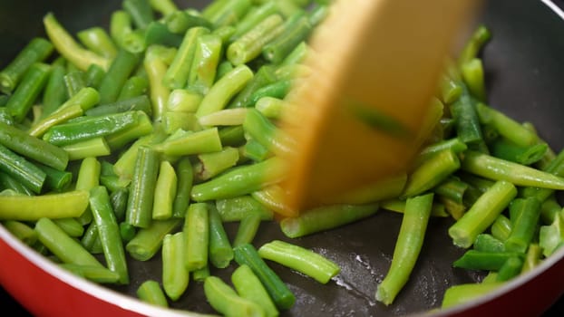Green beans ready for cooking in frying pan. Bio green beans. Cooking concept
