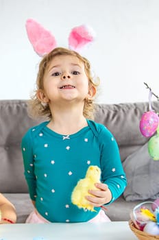 Happy Easter kid with eggs. Selective focus. Child.