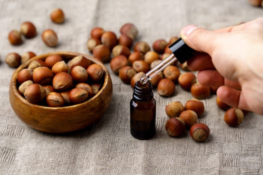 Hazelnut essential oil, nutritious elements. Seasonal nuts use in food and cosmetology