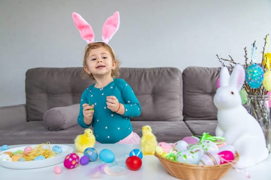 Happy Easter kid with eggs. Selective focus. Child.