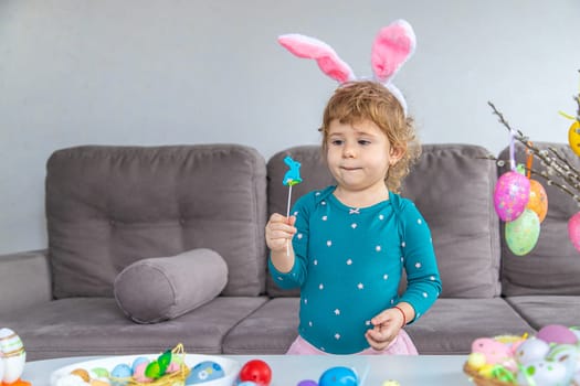 Happy Easter kid with eggs. Selective focus. Child.