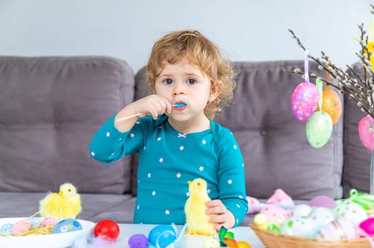 Happy Easter kid with eggs. Selective focus. Child.