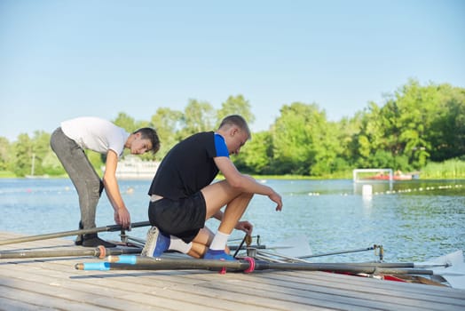 Team of two teenage boys kayaking on river. Active youth lifestyle, water sports, kayak, canoe