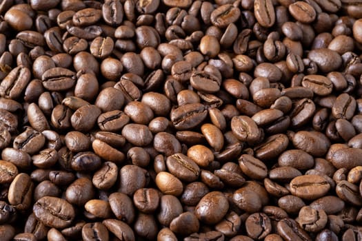 Roasted coffee beans background. Selective focus.