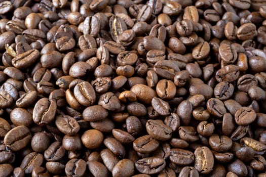 Roasted coffee beans background. Selective focus.