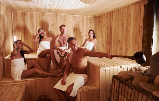 Group of young people together in sauna. Conception of vacation and weekend.