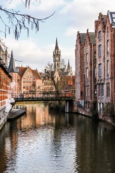 The river and medieval houses of Ghent, a city in the Flemish region of Belgium. Travel concept. High quality photo