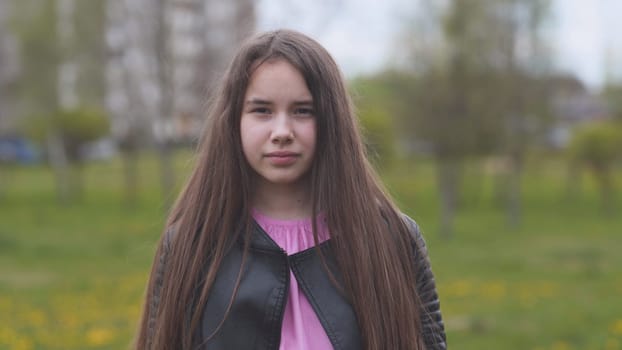 Portrait of a beautiful long-haired teenage girl