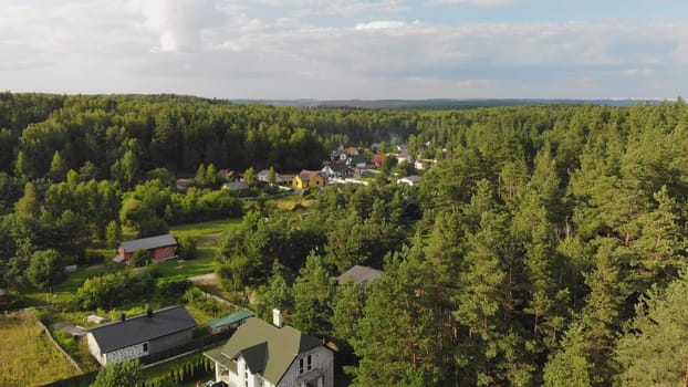 Country houses in the woods. Drone video
