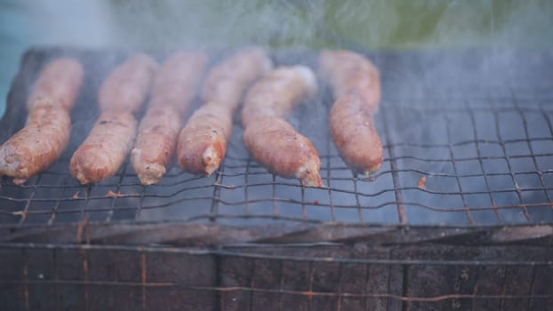 Sausages are fried on the grill