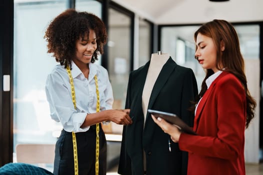 Multi ethnic young teen african american and asian woman fashion designer stylish and friend working at fashion Business studio.