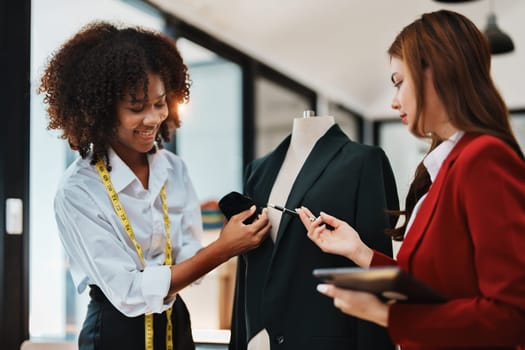 Multi ethnic young teen african american and asian woman fashion designer stylish and friend working at fashion Business studio.