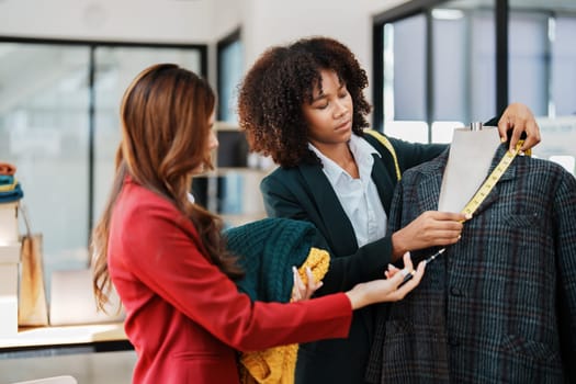 Multi ethnic young teen african american and asian woman fashion designer stylish and friend working at fashion Business studio.