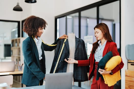 Multi ethnic young teen african american and asian woman fashion designer stylish and friend working at fashion Business studio.