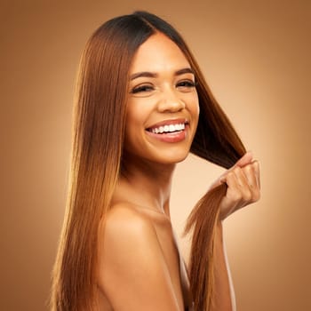 Smile, beauty and haircare portrait of woman in studio for growth, color shine or healthy texture. Aesthetic female happy for strong hair, natural makeup and hairdresser or salon on brown background.