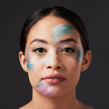 Art, aesthetic and portrait of woman with face paint, creative makeup and self expression. Beauty, creativity and color in artistic cosmetics, skincare and freedom to express for young beautiful girl.