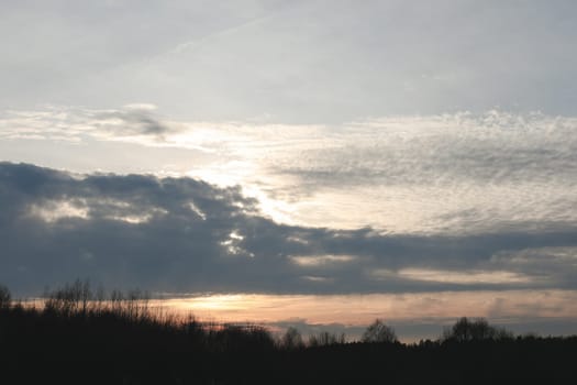 Natural sunset or sunrise. Bright dramatic Sky. Countryside Landscape under Scenic Colorful Sky at Sunset. Sun over skyline, Horizon