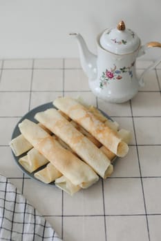 Thin pancakes, crepes for breakfast, making crepes, food photography
