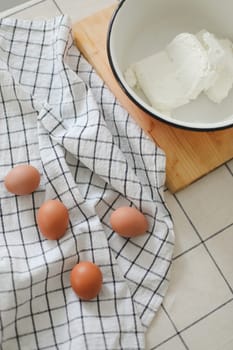 Top view of raw chicken eggs and cheese on table, cooking and making breakfast concept. High quality photo