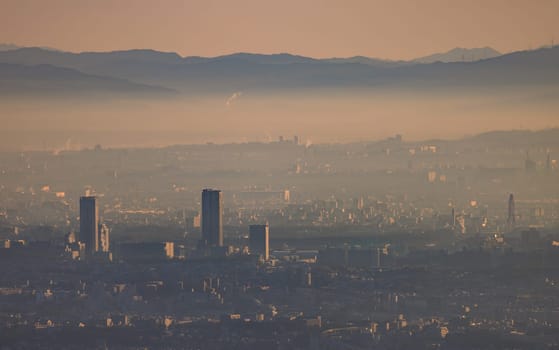 Early morning smog and haze over high rise apartments in sprawling city. High quality photo