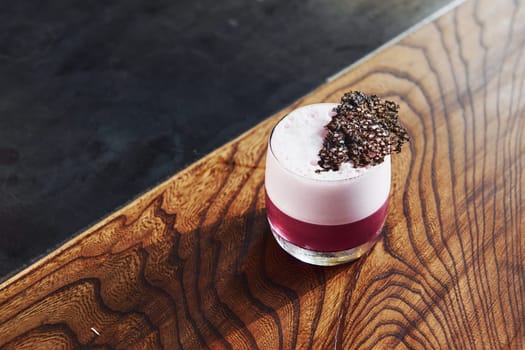 Delicious drink. Close up view of fresh summer cocktail on the wooden table.