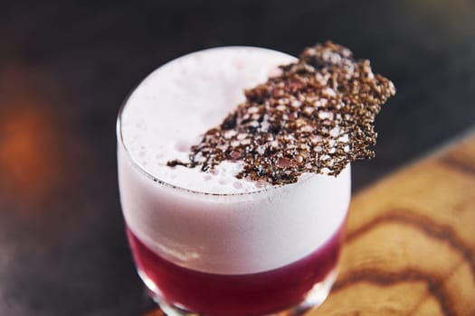 Delicious drink. Close up view of fresh summer cocktail on the wooden table.