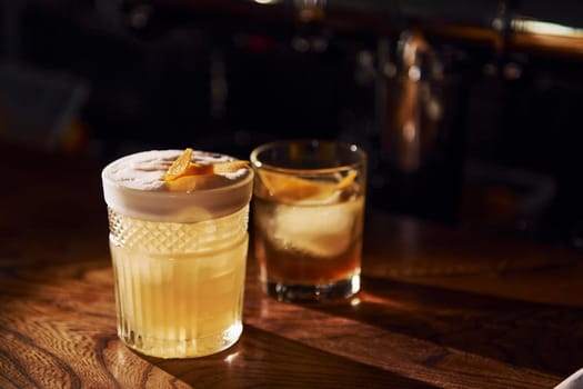 Close up view of fresh summer cocktails on the wooden table.