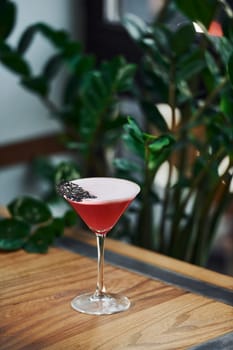 Close up view of fresh summer cocktail on the wooden table.