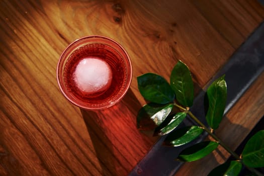 Close up view of fresh summer cocktail on the wooden table.