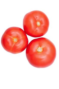 Three fresh healthy tomatoes isolated over white background. On top view. Healthy diet
