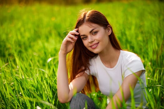 portrait of a happy woman in a white t-shirt with her hands folded in front of her face. High quality photo