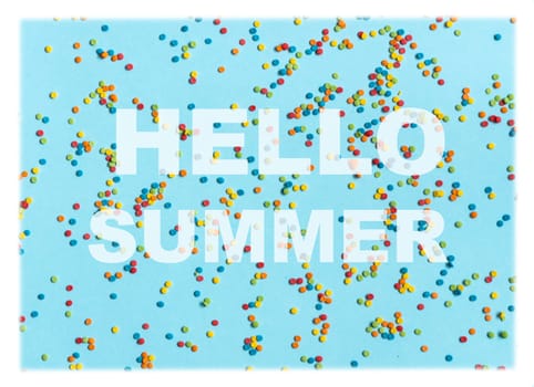 Text Hello summer on blue bsckground with colorful dots. Bright and positive