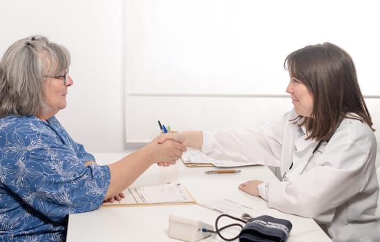 doctor greeting her patient before the consultation