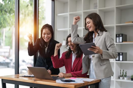 Successful business advisor people achieving goals while using laptop computer.