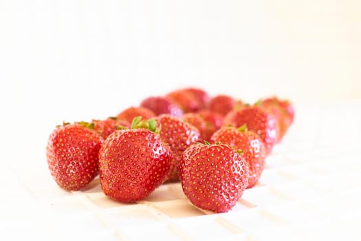 a sweet soft red fruit with a seed studded surface