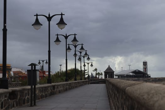 Walk along the wall of Plaza Europa on a cloudy day in August Puerto de la Cruz Tenerife