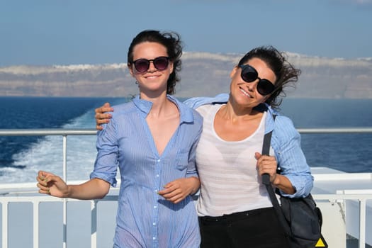 Family travel luxury cruise vacation, mother and teenage daughter enjoy sea trip on deck of liner on sunny summer day