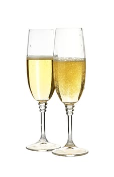 Close up two half full glasses of champagne or prosecco white sparkling wine, isolated, cut out PNG on transparent background