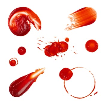 Close up collection of different red ketchup tomato sauce wet stains isolated on white background, top view, directly above