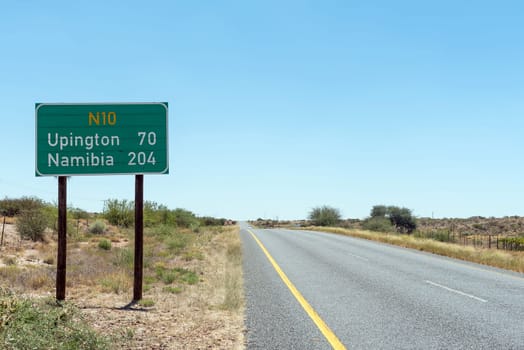 A distance sign on road N10 near Grootdrink in the Northern Cape Province. The distance to Namibian border is shown