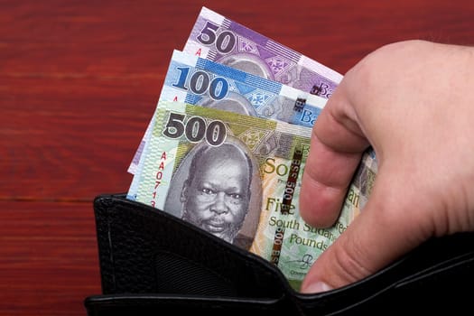 South Sudanese money - Pounds in a black wallet