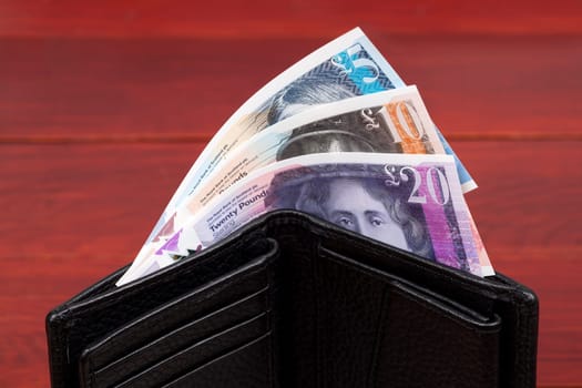 Scottish money - Pound in the black wallet