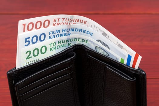 Danish krone in the black wallet