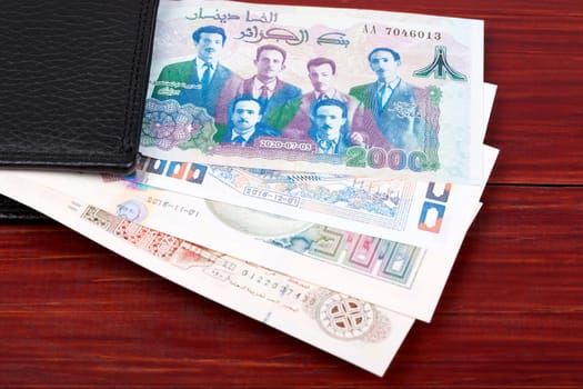 Algerian dinar in the black wallet