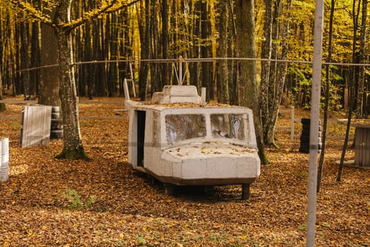 old abandoned helicopter. Autumn park. stone machine in the autumn park.