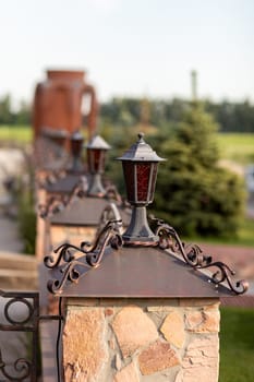 retro lanterns or classic lamps for fence decoration.